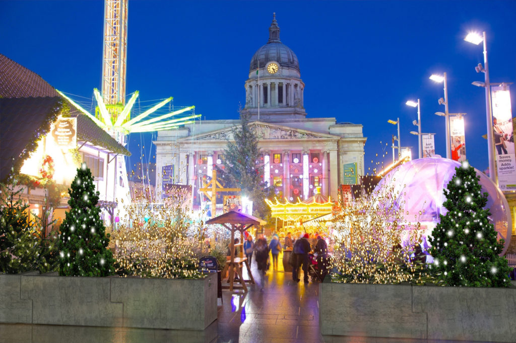 Computer generated image of a Christmas market protected by KarabloK barrier which has been festively planted and decorated to soften its visual impact